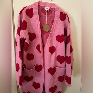 Pink/red open long line cardigan.